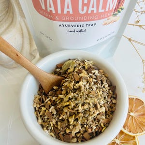 Close up of loose leaf herbal tea blend with dried botanicals in bowl, aromatic calming tea for relaxing evening routine and cozy tea moments