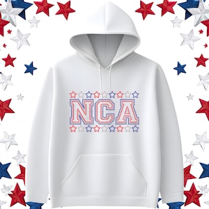 May include: White hooded sweatshirt with the letters "NCA" in red and blue, outlined with stars. The design is centered on the chest. The background features red, white, and blue stars.