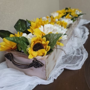 Faux flower arrangement, artificial flowers, tabletop flower arrangement.