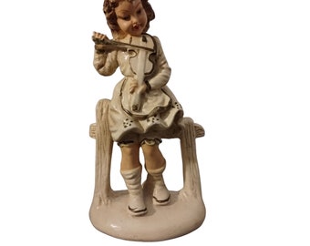 Esco Production Co. Chalkware-meisje uit de jaren 70 met viool op hekbeeldje