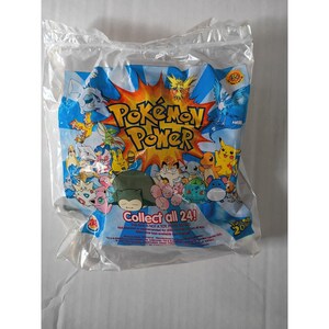 May include: Sealed plastic bag containing a "Pokémon Power" toy. The packaging is blue and white with various Pokémon characters and the text "Collect all 24!". The bag is sealed and appears to be unopened.