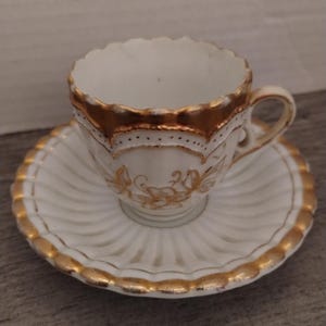 Gold Porcelain Antique Demitasse Tea Cup and Saucer