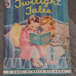 May include: A vintage children's book titled "Twilight Tales" with a blue and white striped cover. The cover features an illustration of two children in pajamas reading a book together on a couch with a dog.