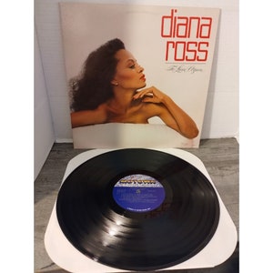 May include: A vinyl record album cover featuring Diana Ross with the title "To Love Again". The album cover is white with red text and a photo of Diana Ross.