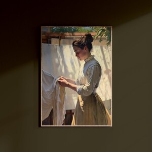 May include: A painting of a woman in a white blouse and brown skirt, standing in a sunlit outdoor setting, holding a white cloth. The woman is looking down at the cloth, and the background is a blurry image of trees and a clothesline with white sheets hanging on it.
