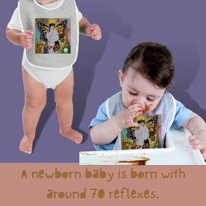 May include: Two babies wearing bibs with butterfly designs. The bibs are grey with a white trim. The baby on the left is standing and the baby on the right is sitting in a high chair. The baby on the right is wearing a blue shirt and is eating. The text on the bibs says "A newborn baby is born with around 70 reflexes."