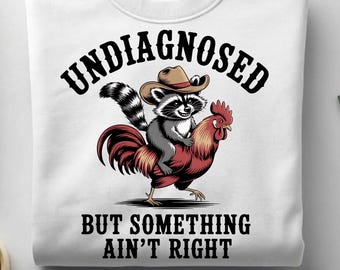 Undiagnosed But Something Ain't Right Raccoon PNG, Raccoon Riding Chicken, Cowboy Animal Humor, Funny Sublimation Design, fanny shirt png