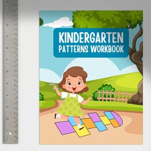 May include: A colorful workbook cover with the title "Kindergarten Patterns Workbook". A cartoon girl in a green dress jumps on a hopscotch path.