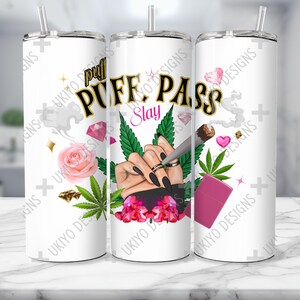 May include: White tumbler with a pink, green, and gold design. The design features a hand holding a joint, with the words "Puff Pass Slay" in gold lettering.