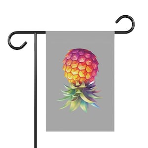 May include: A colorful pineapple garden flag with a gray background. The pineapple is a vibrant mix of pink, orange, and yellow with green leaves.