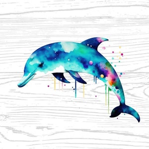 May include: A watercolor painting of a blue dolphin with splashes of pink, yellow, and green paint. The dolphin is jumping out of the water. The background is a white wood grain texture.