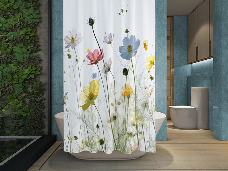 May include: White shower curtain with a floral print featuring pink, yellow, blue, and white cosmos flowers on a white background.