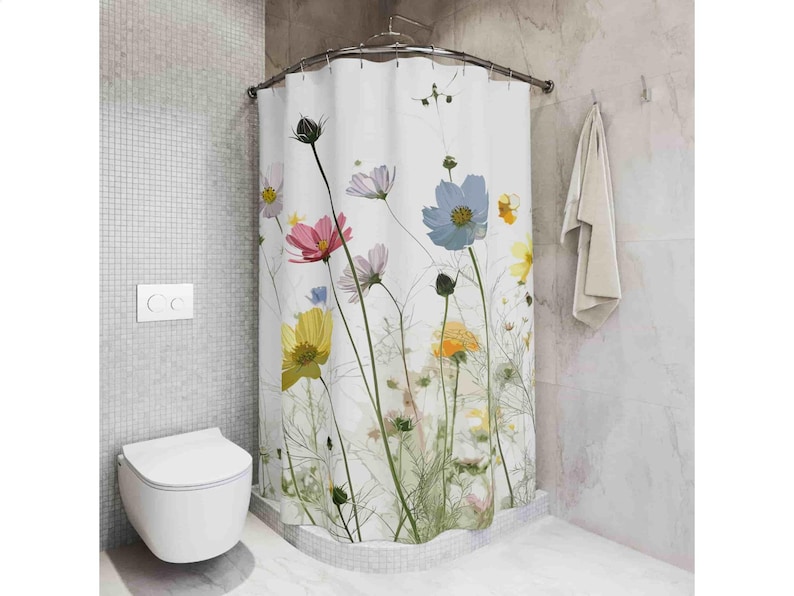 May include: White shower curtain with a floral print featuring pink, yellow, blue, and white flowers. The flowers are on a white background with green stems and leaves.