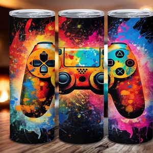 May include: Three colorful, abstract,  stainless steel tumblers with a black and yellow video game controller design. The controller is surrounded by colorful paint splatters.