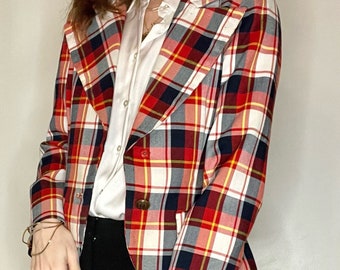 May include: A red, white, and blue plaid blazer with a button closure. The blazer has a cropped fit and a collar.