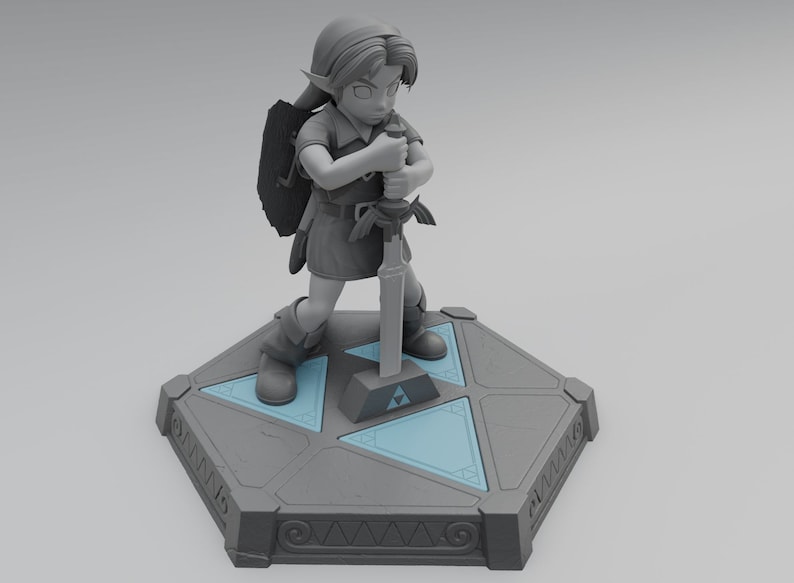 May include: A gray figurine of Link from The Legend of Zelda video game series, holding a sword and shield. The figurine is standing on a gray hexagonal base with a blue triangular design.