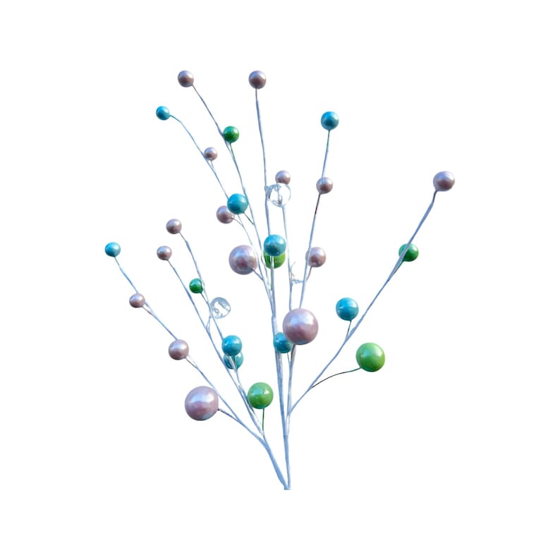 May include: A silver twig spray with pink, blue and green round ornaments. The ornaments are shiny and have a pearlescent finish.