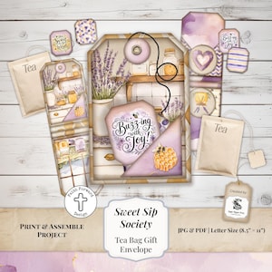 May include: A tea bag gift envelope design with a lavender theme. The design includes illustrations of lavender, honeycombs, and the text "Buzzing with Joy!". The words "Sweet Sip Society" are also visible. The design is for a print and assemble project.