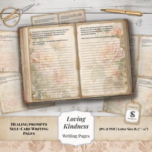 May include: Open journal with lined pages and floral accents, featuring prompts for self-care writing. Includes a gold pen, scissors, and additional writing pages. The journal is labeled "Loving Kindness Writing Pages."