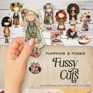 Puede incluir: Un conjunto de 58 pegatinas recortadas con ilustraciones de muñecas, calabazas, flores y un tocadiscos vintage. Las pegatinas están impresas en papel tamaño carta de 21,6 cm x 27,9 cm. También se ve el texto "Pumpkins & Posies" y "Fussy Cuts".