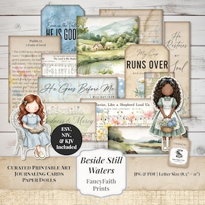 May include: A collection of printable journaling cards and paper dolls featuring watercolor landscapes, floral motifs, and religious text including Psalm 23. The set includes illustrations of two girls, one reading and one holding a basket of flowers.