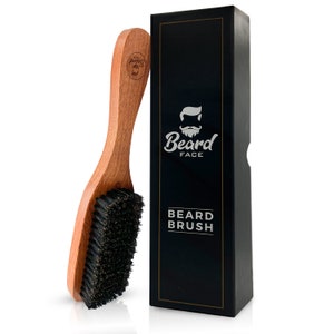 May include: A wooden beard brush with black bristles. The brush is packaged in a black box with the words "Beard Face" and "Beard Brush" printed in silver.
