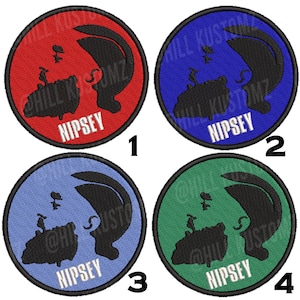 May include: Four round embroidered patches with a black silhouette of a person's head and shoulders. The patches are red, blue, light blue, and green. Each patch has the word "NIPSEY" in white text.