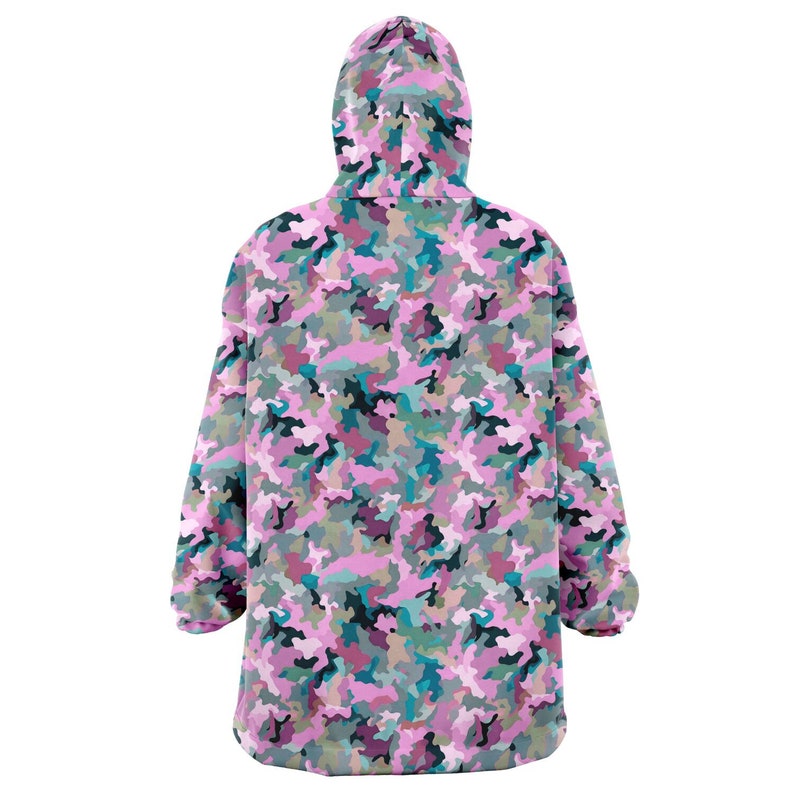 May include: A pink, green, and blue camouflage print hooded blanket. The blanket is made of soft fleece and is perfect for snuggling up on the couch.
