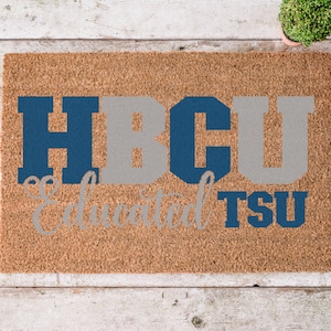 May include: A brown coir doormat with the text "HBCU Educated TSU" in white and blue lettering.