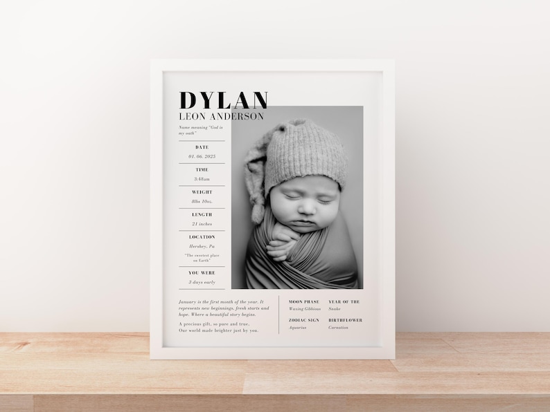 May include: A framed black and white print featuring a baby's portrait. The print includes the baby's name, birth date, time, weight (8lbs 10oz), and length (21 inches). The baby is wearing a knitted hat and wrapped in a blanket.