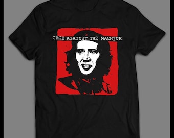 Revolutionary Parody Graphic Tee – Cage Against the Machine Satire Shirt – Funny Red & Black Pop Culture T-Shirt