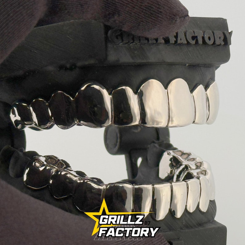 Handcrafted solid silver full mouth teeth jewelry for hip hop fashion.
