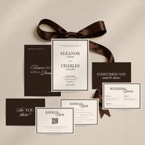 May include: A wedding invitation suite featuring dark brown and cream paper cards with elegant serif typography. The set includes a main invitation, details card, and RSVP cards with a QR code, all tied together with a dark brown satin ribbon.