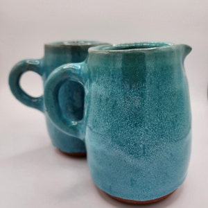 2x Aqua Blue Earthenware Pitchers