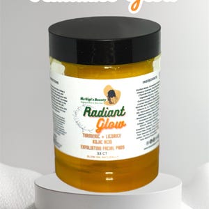 May include: A yellow jar of facial pads labelled "Radiant Glow" with the text "Turmeric + Licorice Kojic Acid Exfoliating Facial Pads 33 CT Glow On Naturally" on the label.