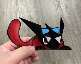 May include: A black and red cartoon character with blue accents. The character is a stylized version of a mythical creature with large ears and a pointed snout. The character is looking at the viewer with a mischievous expression.