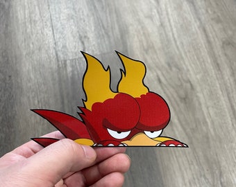 May include: A red and yellow cartoon character with angry eyes peeking over a surface. The character has a flame-like design on its head.