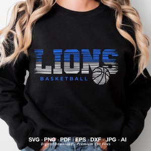 May include: Black sweatshirt with a blue and white striped graphic that says "LION'S BASKETBALL" with a basketball graphic.