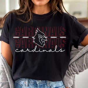 Fierce cardinal head outline on layered text design for cheer and game day