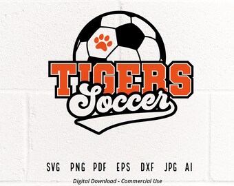 May include: A black and white soccer ball with an orange paw print in the center. The text "TIGERS Soccer" is in orange and black letters with a black and white swirl design.