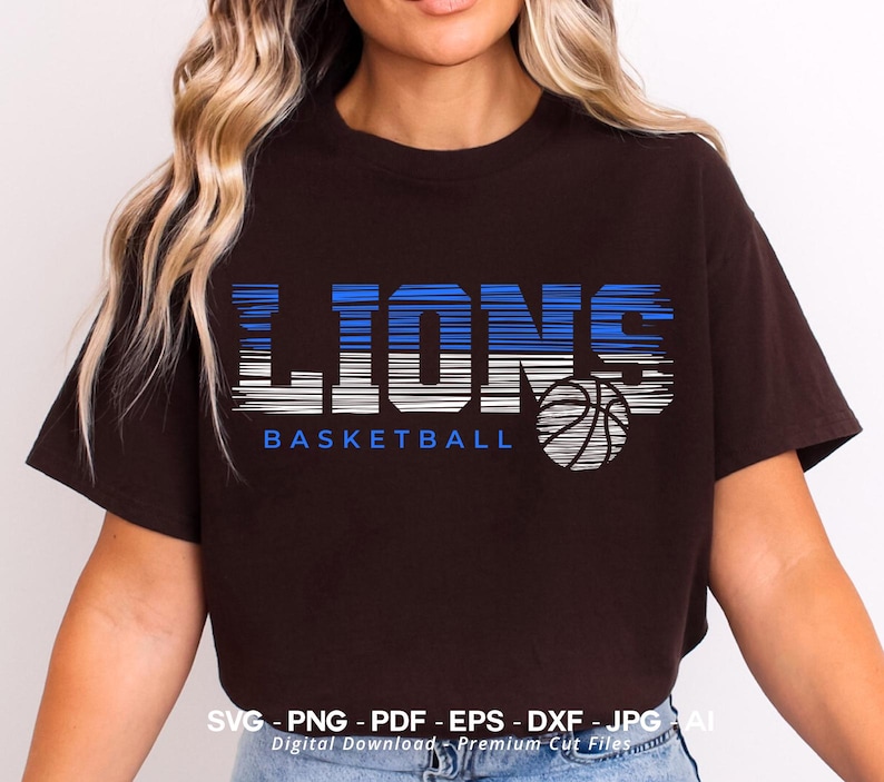 May include: A black t-shirt with a blue and white graphic design that says "LIONS BASKETBALL" with a basketball graphic.