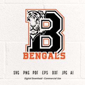 May include: A black and orange graphic design of a letter "B" with a tiger's head inside the letter. The text "BENGALS" is below the letter. The design is on a white brick background.