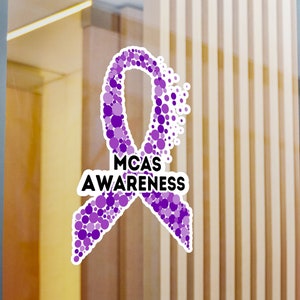 May include: Purple awareness ribbon made of small circles, with the text "MCAS AWARENESS" in black.