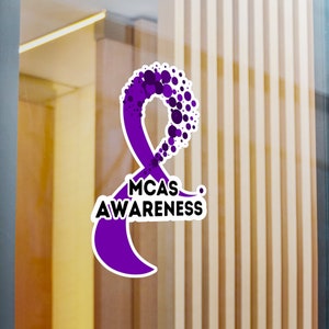 May include: Purple awareness ribbon with the text "MCAS AWARENESS" in black.