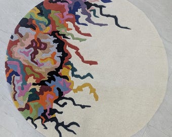 Handmade Woolen Floral Rug: Multi-Colored Irregular Shape