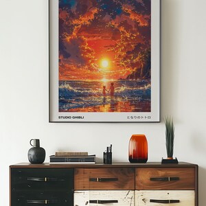 May include: A framed poster of the Studio Ghibli film "Ponyo" by Hayao Miyazaki. The poster features a sunset scene with two children walking on a beach. The text "Ponyo", "Studio Ghibli", and "となりのトトロ" (Totoro) are visible on the poster.