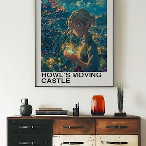 May include: A framed poster featuring a scene from "Howl's Moving Castle." The artwork depicts a young woman holding a glowing object, with a castle and cityscape in the background. The poster is displayed above a wooden dresser.