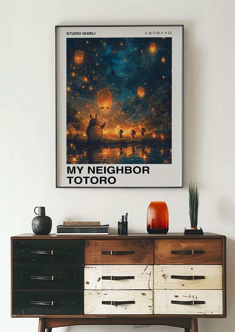 May include: A poster featuring a scene from the Studio Ghibli film "My Neighbor Totoro". The poster depicts Totoro, a large, furry creature, standing in a forest with a group of children. The sky is filled with glowing lanterns and stars. The poster is titled "My Neighbor Totoro" and features the Japanese text "となりのトトロ" which translates to "My Neighbor Totoro".