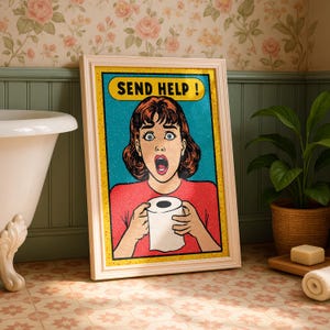 May include: Framed pop art print featuring a distressed woman holding toilet paper with the words "SEND HELP!" in a yellow banner. The artwork has a retro comic book style with bold colors and a distressed look. The frame is white.