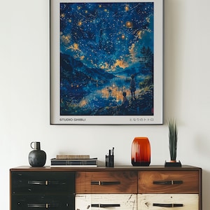 May include: A framed poster of the Studio Ghibli film "Princess Mononoke" with a night sky scene and the Japanese text "もののけ姫" (Mononoke Hime).